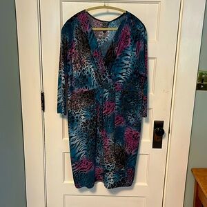 Ladies dress with stretch waist. Pleat that opens on skirt .